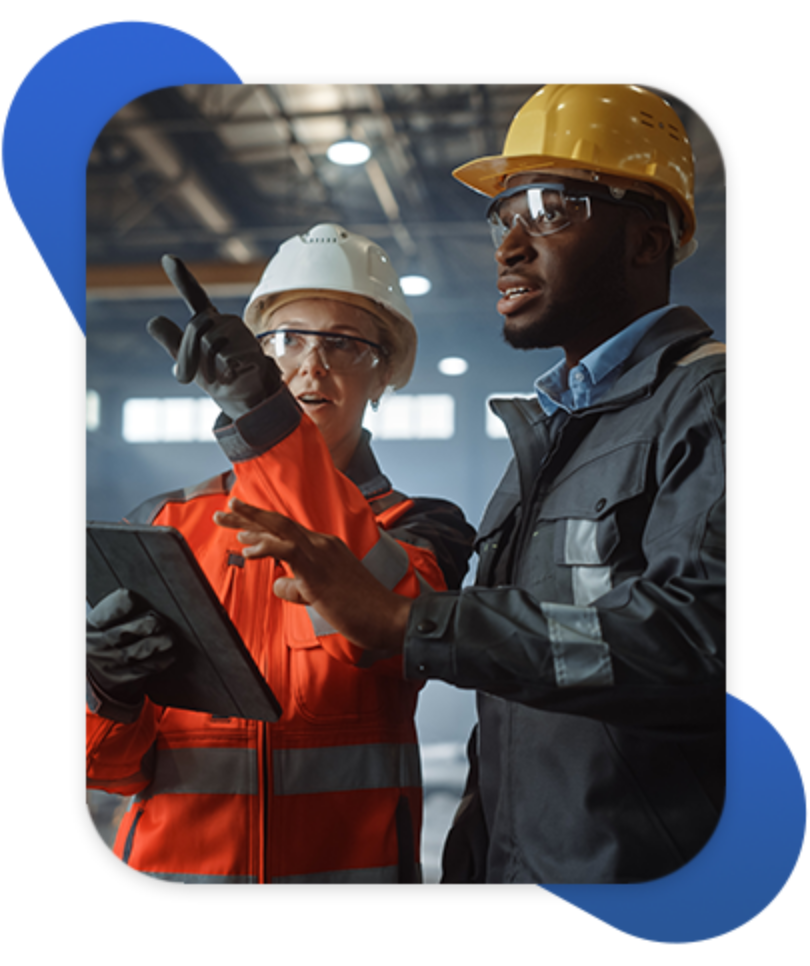 Manufacturing employees discussing plant operations